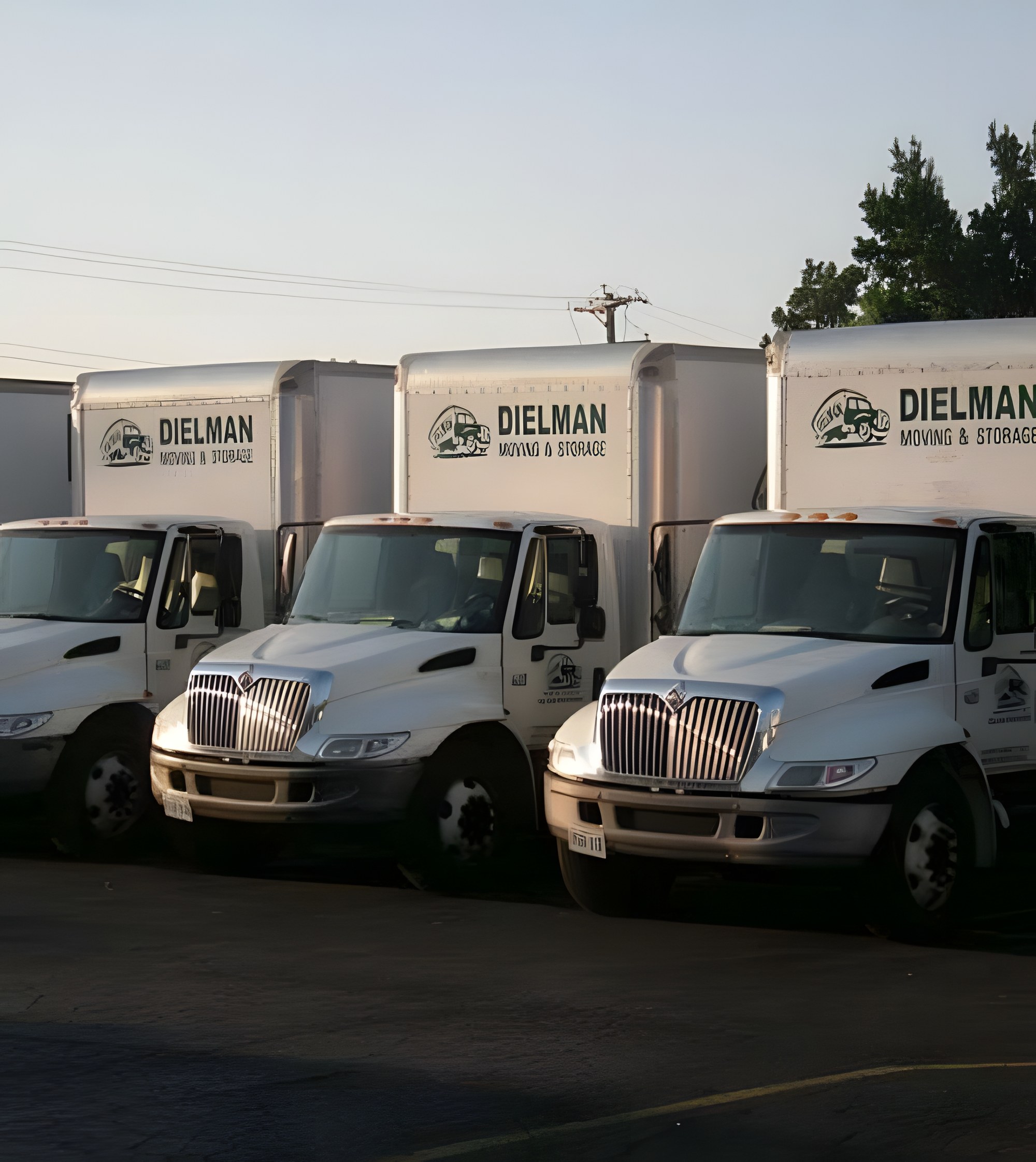 The Dielman Moving fleet of green branded trucks at the St. Louis yard